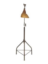 A Steel Tripod Base Articulated Floor Lamp