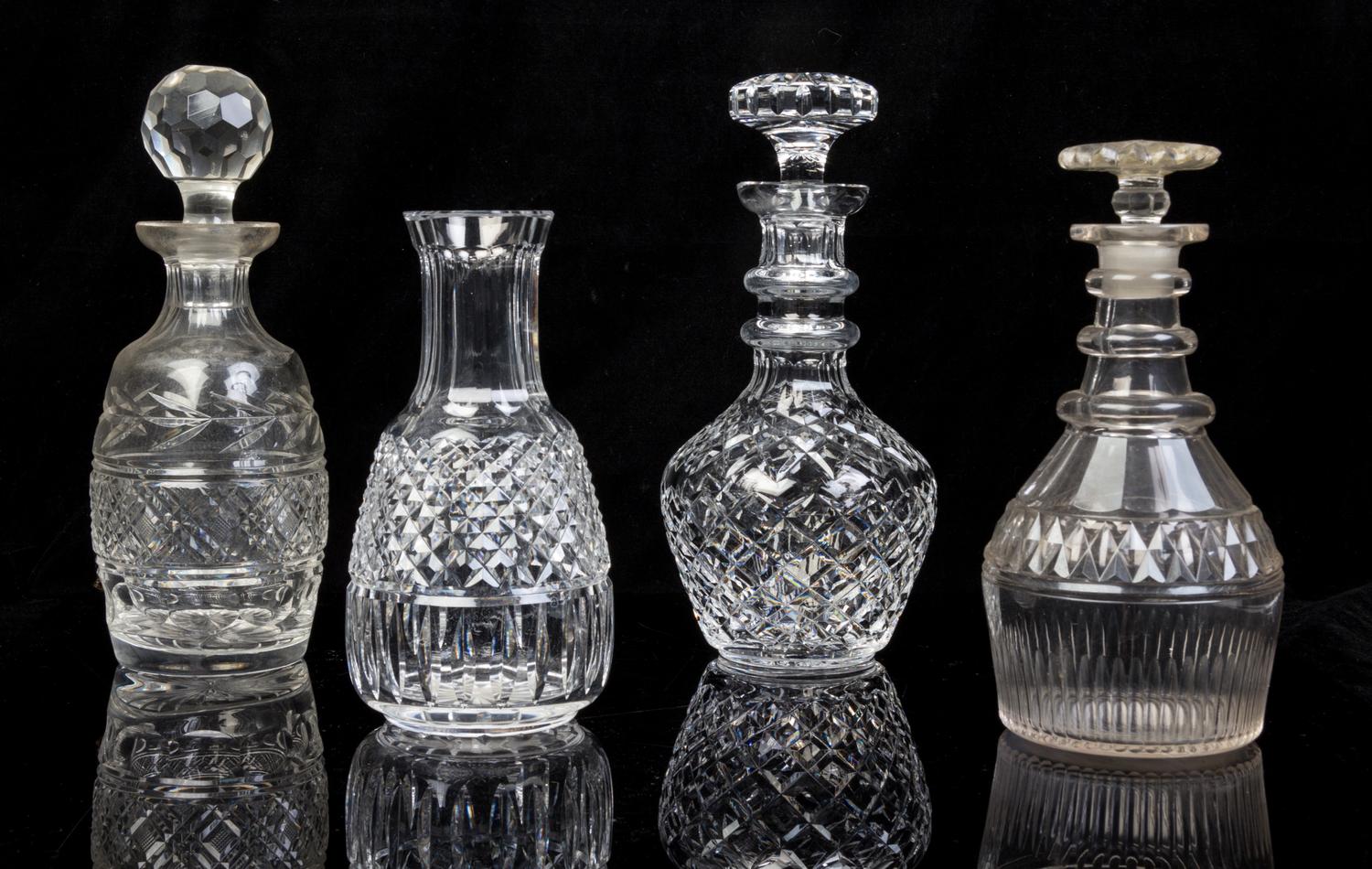Four Cut Glass Decanters Height of tallest 10 1/2 inches.