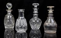 Four Cut Glass Decanters Height of tallest 10 1/2 inches.