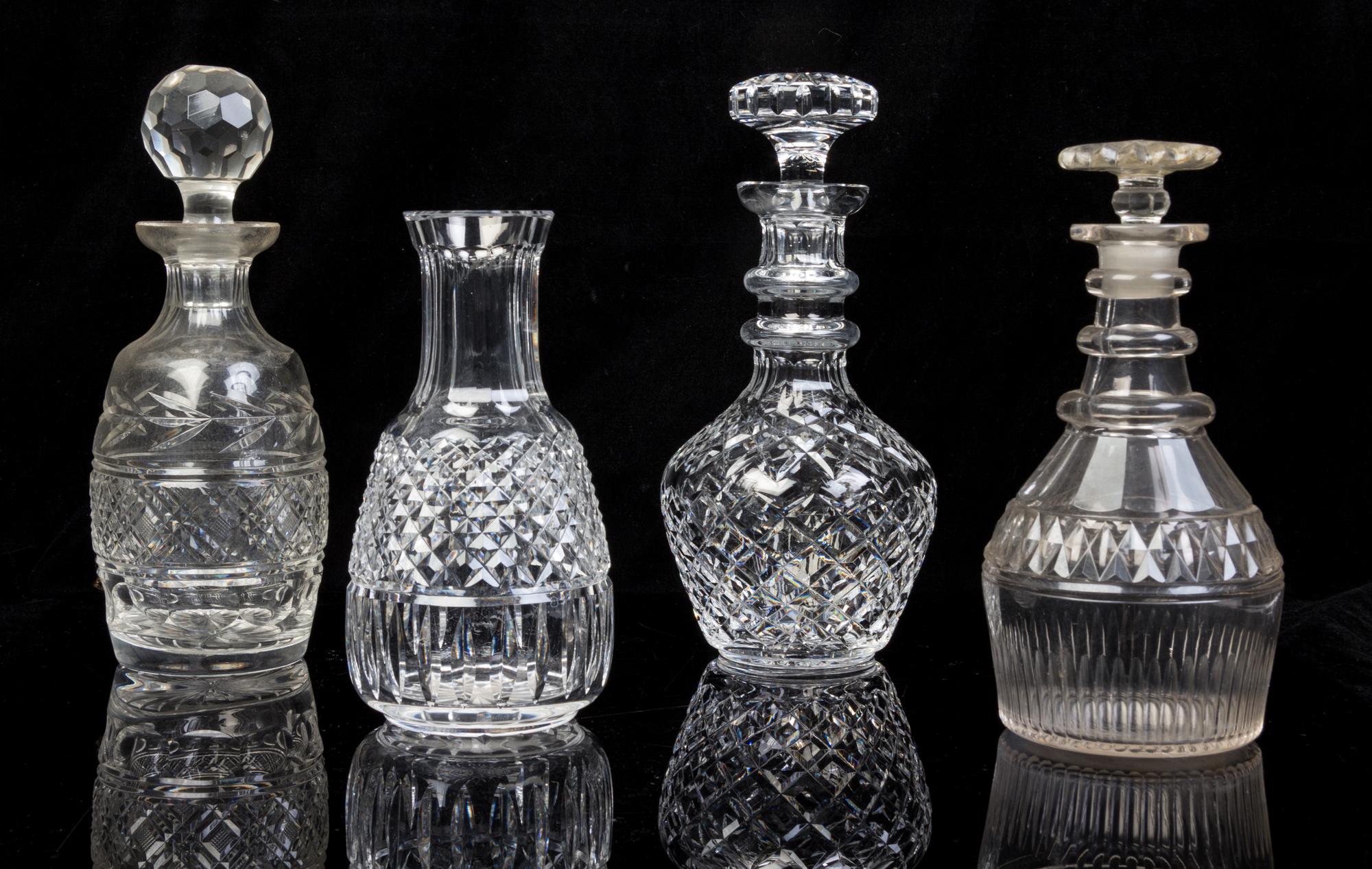 Four Cut Glass Decanters Height of tallest 10 1/2 inches.