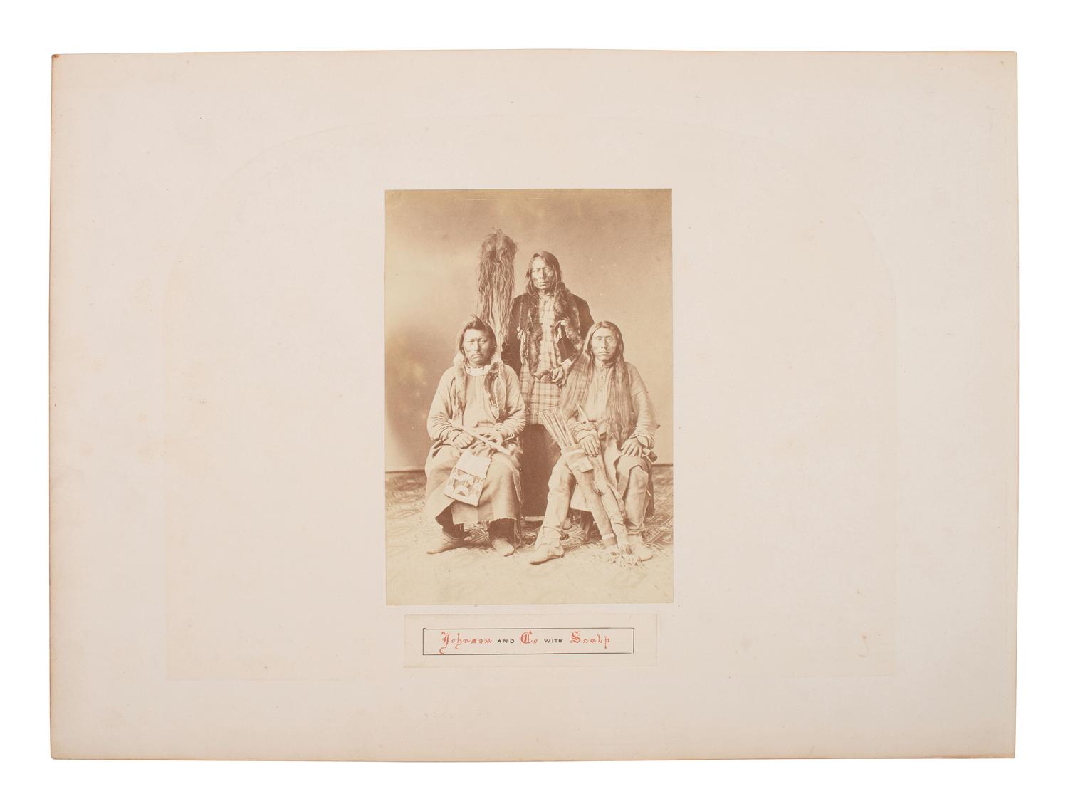 Johnson and Co. with Scalp . Albumen photograph of Ute Braves involved with the Battle of Milk Creek. Ca 1870s.
