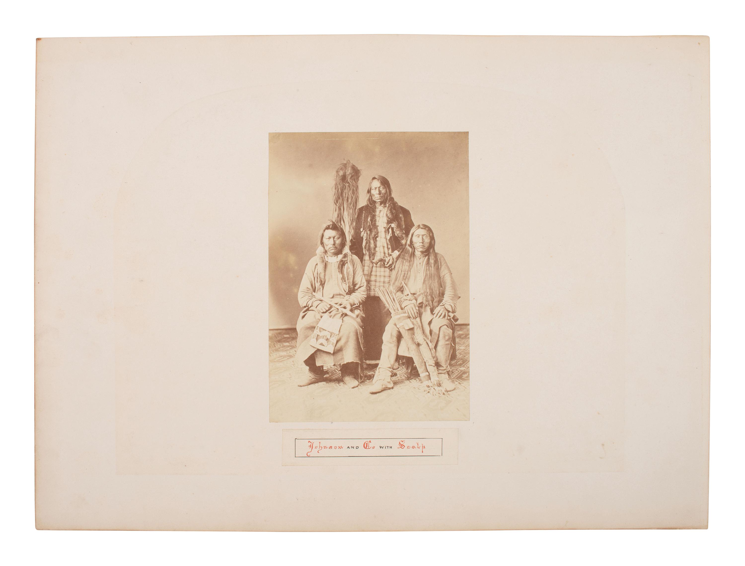 Johnson and Co. with Scalp . Albumen photograph of Ute Braves involved with the Battle of Milk Creek. Ca 1870s.
