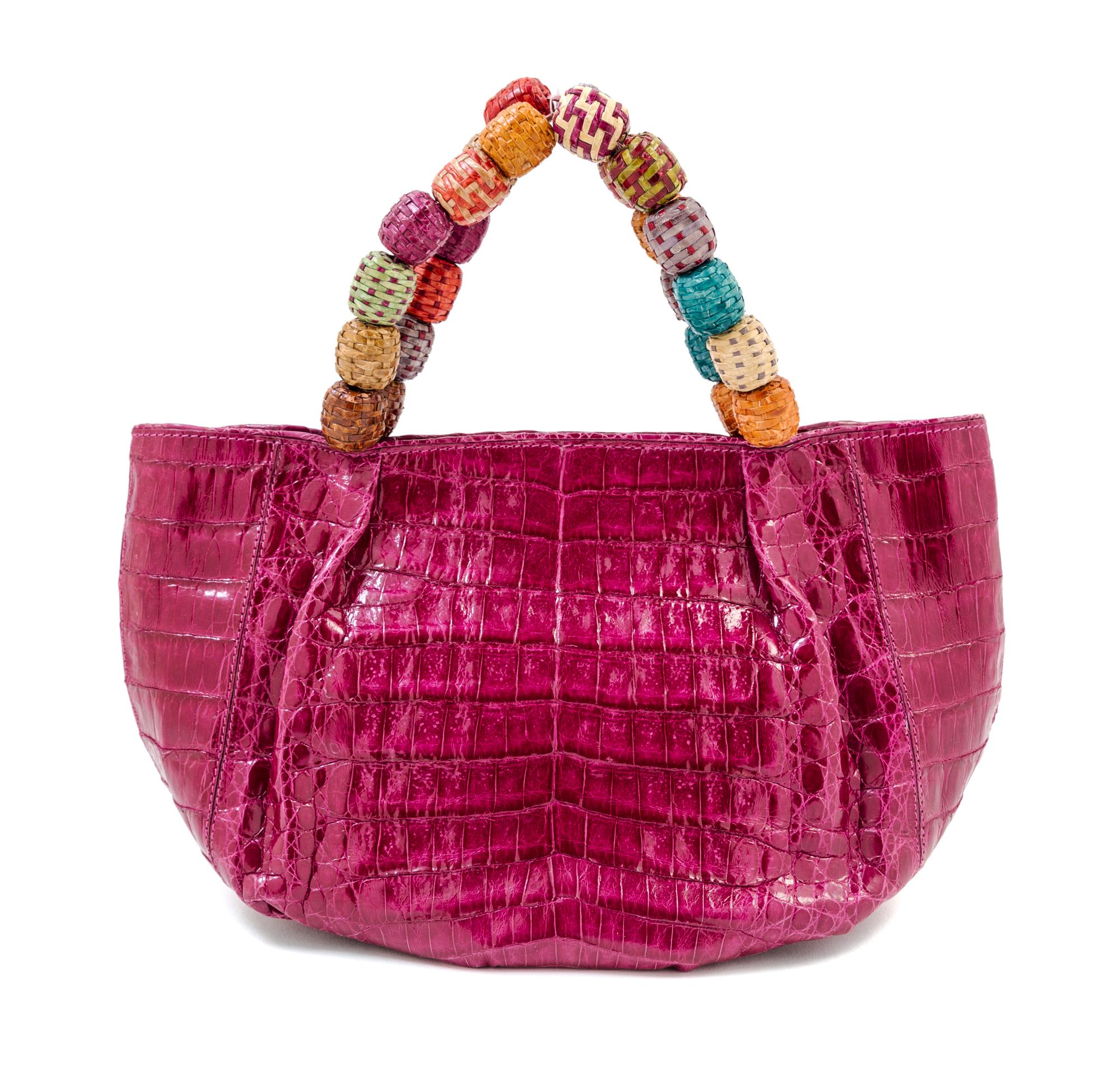 A Nancy Gonzales Fuchsia Crocodile Mini Handbag, 10.25" x 6" x 4.5." Strap drop: 3.5."