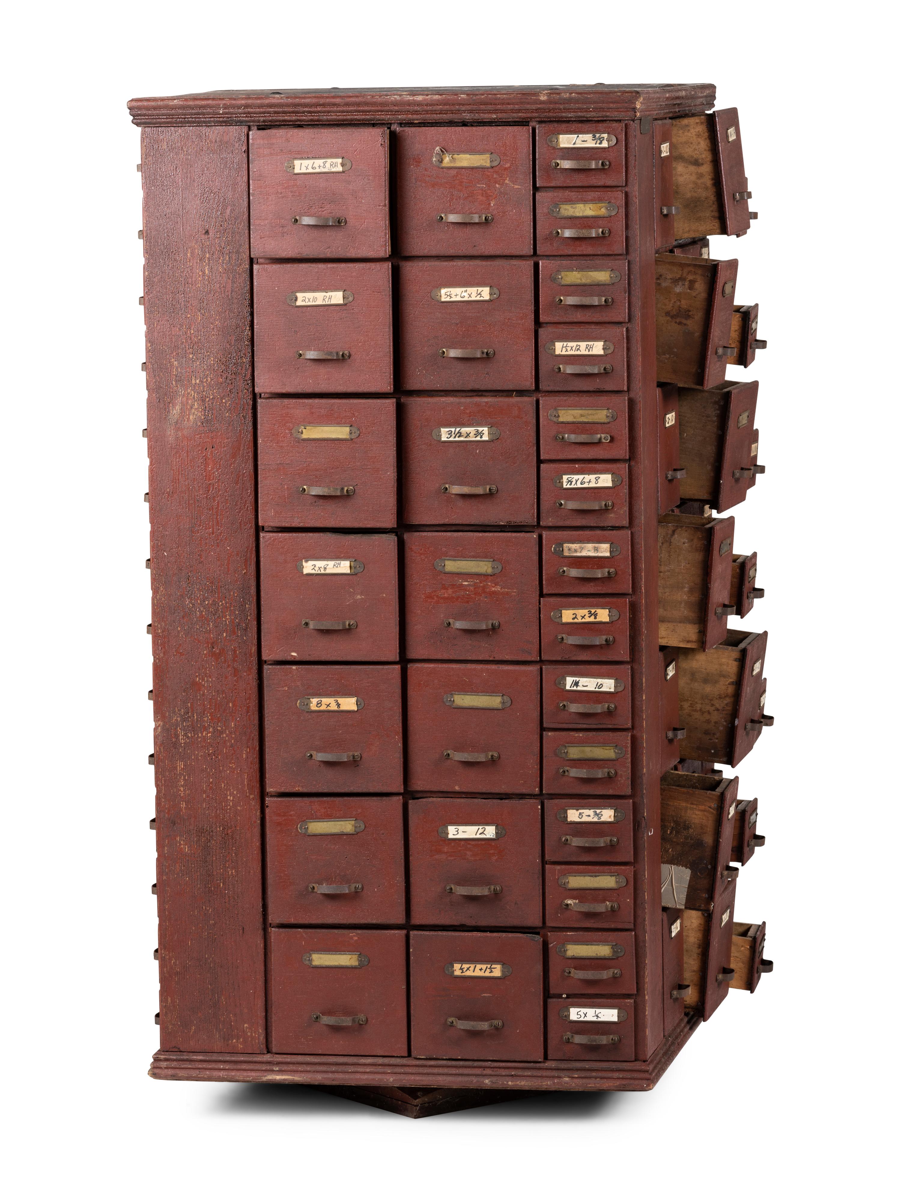 A Rotating Hardware Store Storage Cabinet in Red Paint