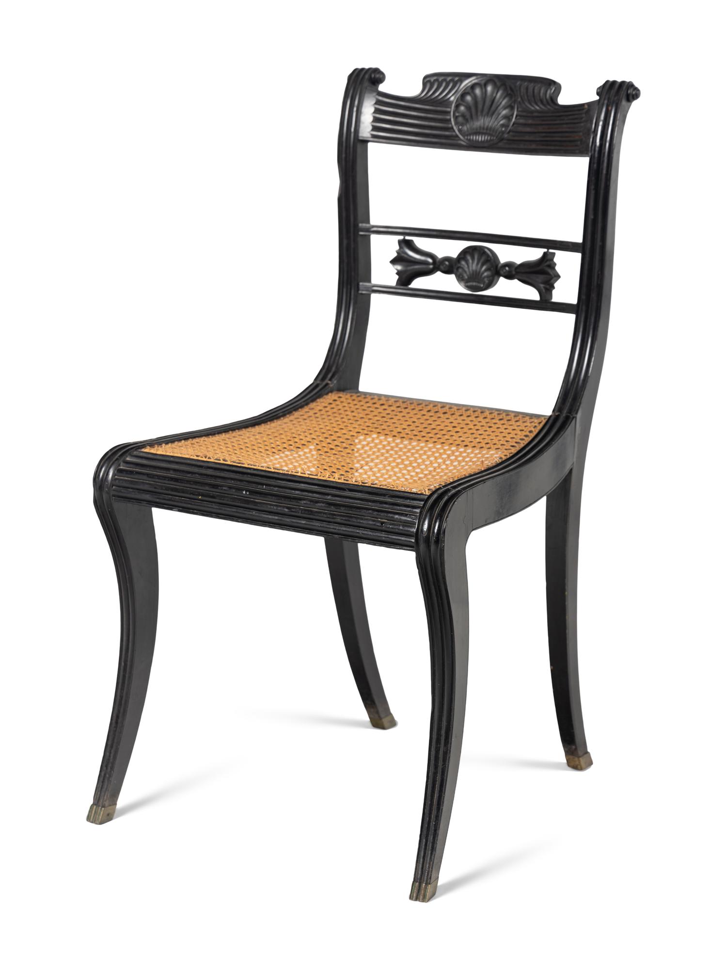 A Set of Four Regency Shell Carved Ebony Side Chairs