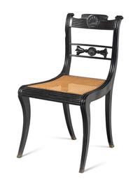 A Set of Four Regency Shell Carved Ebony Side Chairs