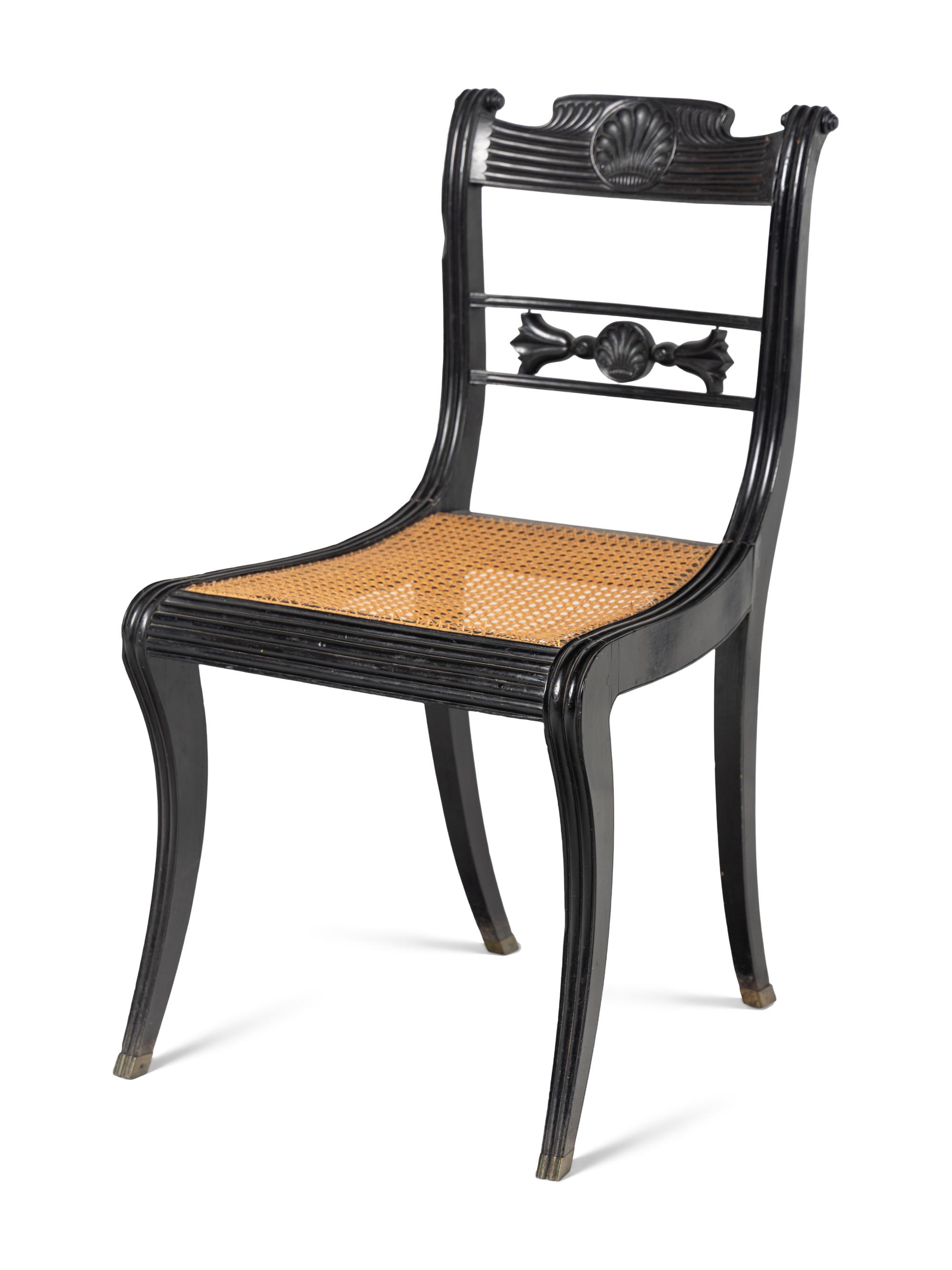 A Set of Four Regency Shell Carved Ebony Side Chairs