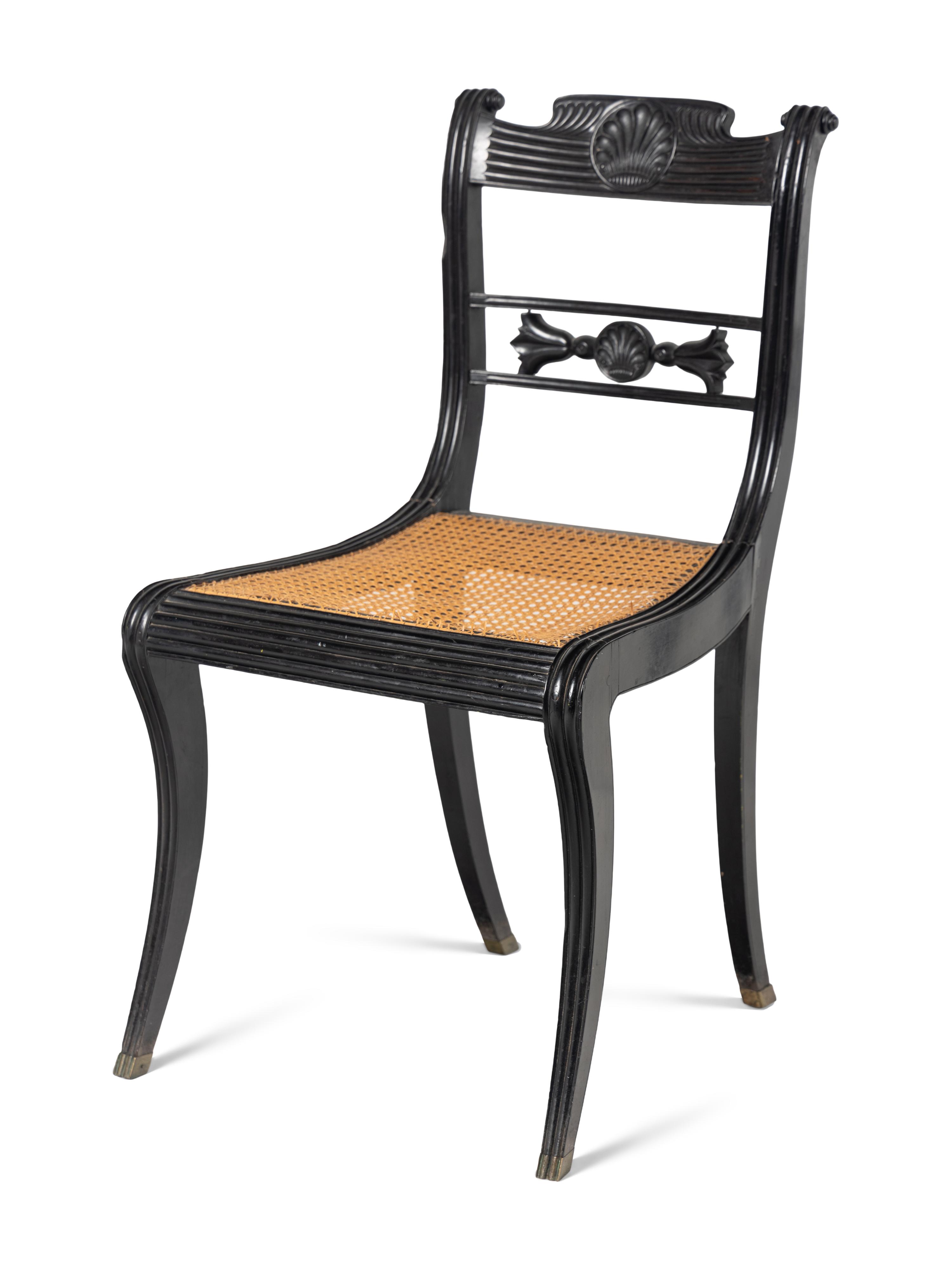 A Set of Four Regency Shell Carved Ebony Side Chairs
