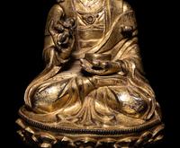 A Tibetan Gilt Bronze Figure of a Seated Karmapa