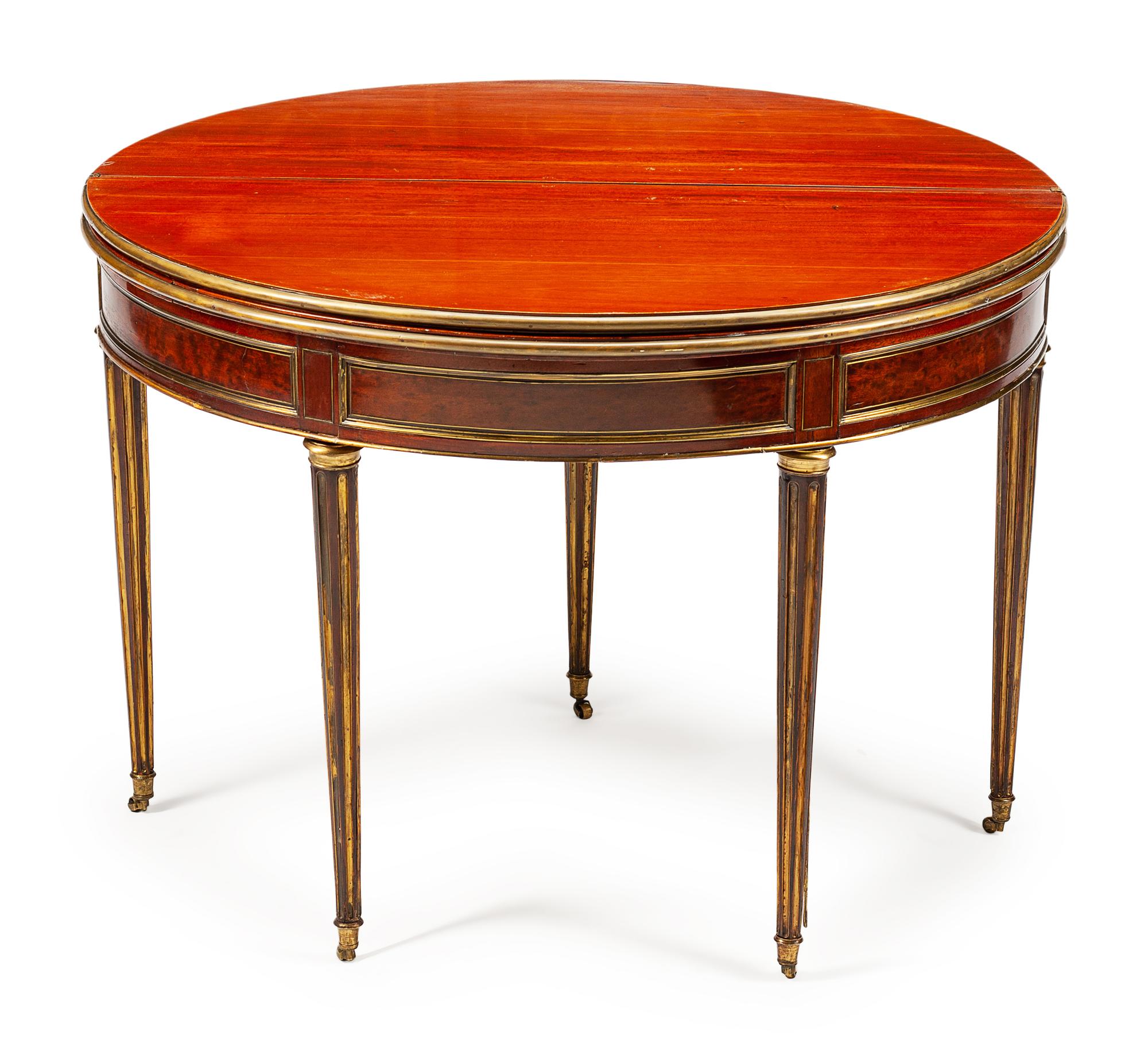 A Louis XVI Style Brass-Mounted Mahogany Triple-Top Demilune Games Table