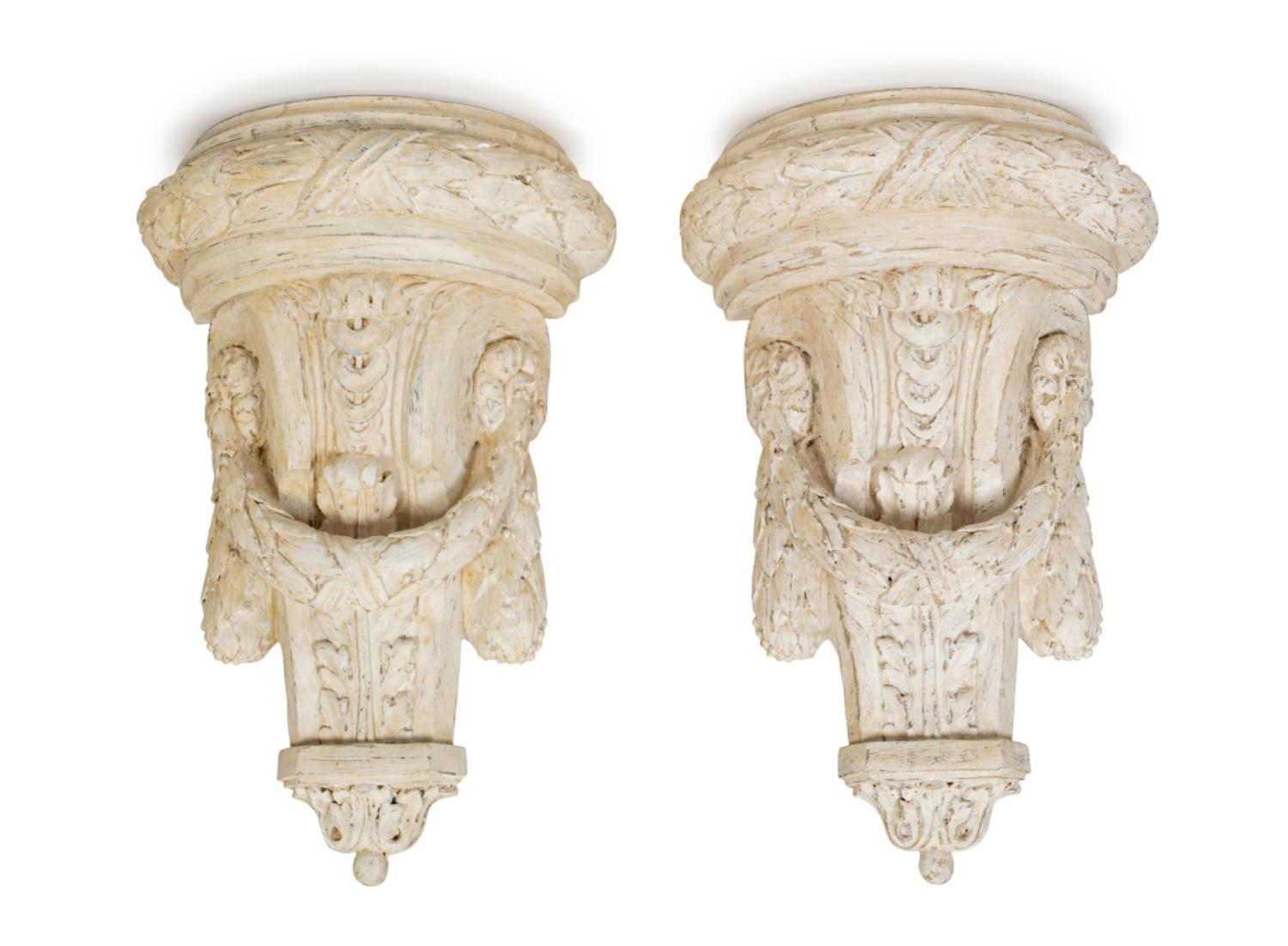 A Pair of Neoclassical Style Cast Stone Wall Mounted Urns — 20TH CENTURY