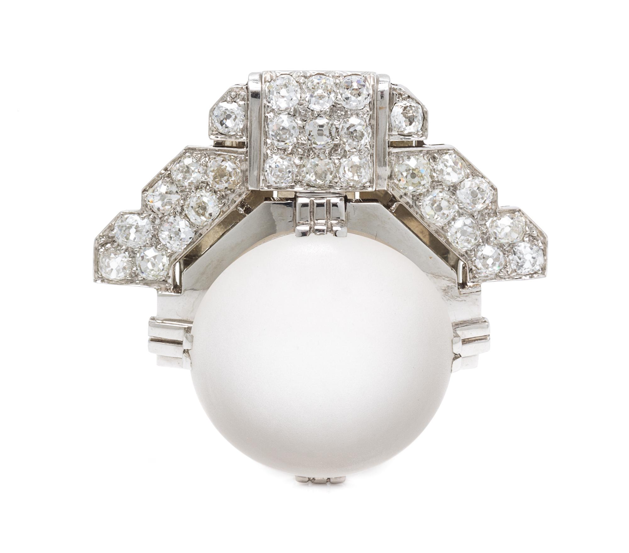 An Art Deco Platinum, Rock Crystal and Diamond Clip Brooch, 15.10 dwts.