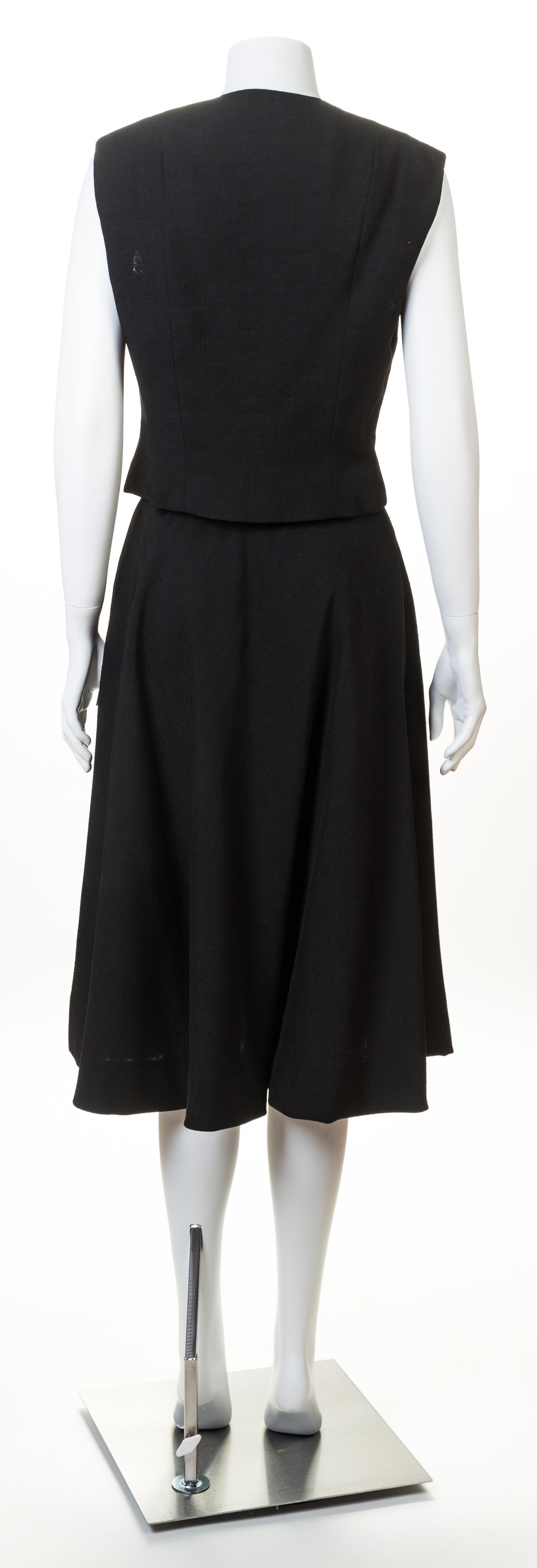 A Pauline Trigere Black Sleeveless Vest and Skirt Set, No size.