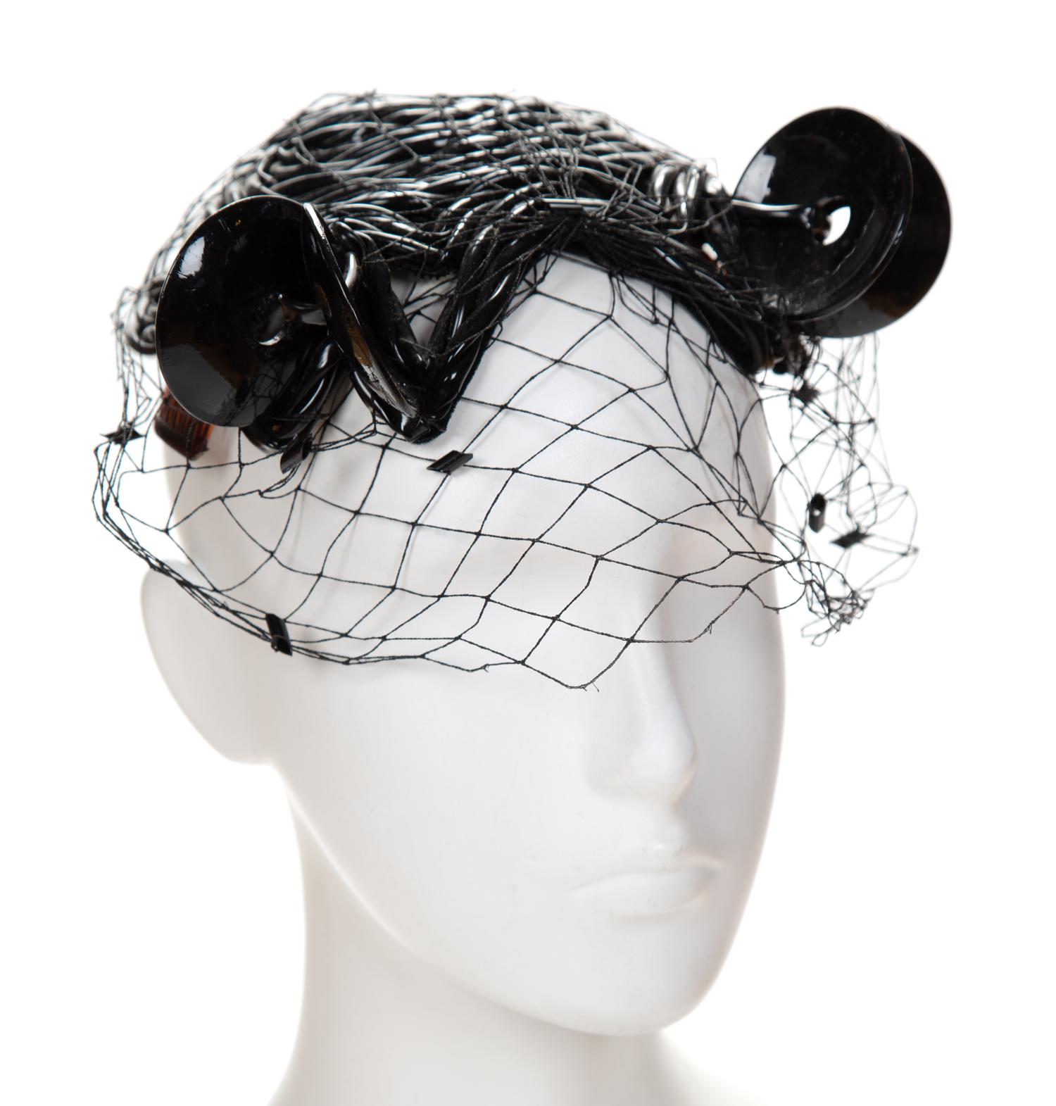 A Bes-Ben Rare Black Plastic Tubed Hat, 6" x 6".
