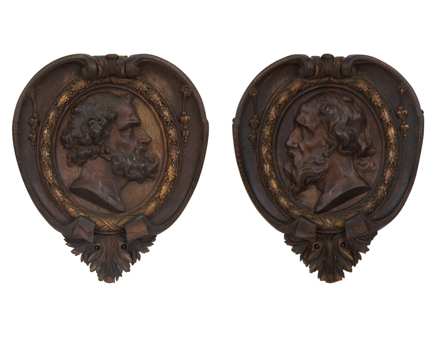 A Pair of Continental Carved Oak and Parcel Gilt Profile Plaques