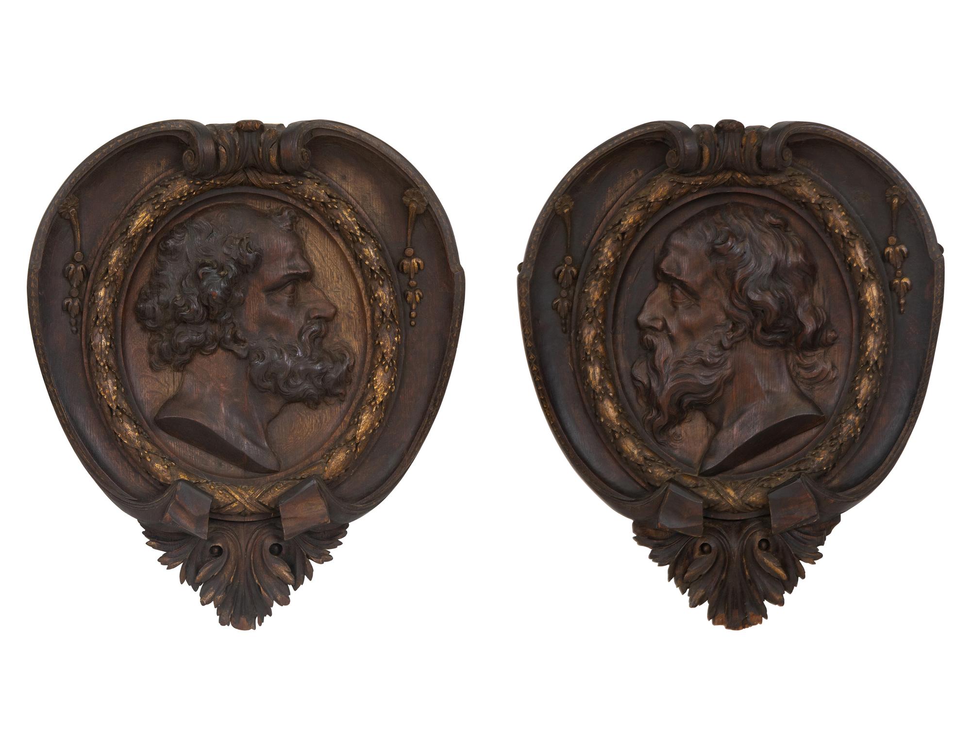 A Pair of Continental Carved Oak and Parcel Gilt Profile Plaques