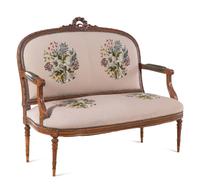 A Louis XVI Carved Walnut Seating Suite with Petit Point Upholstery