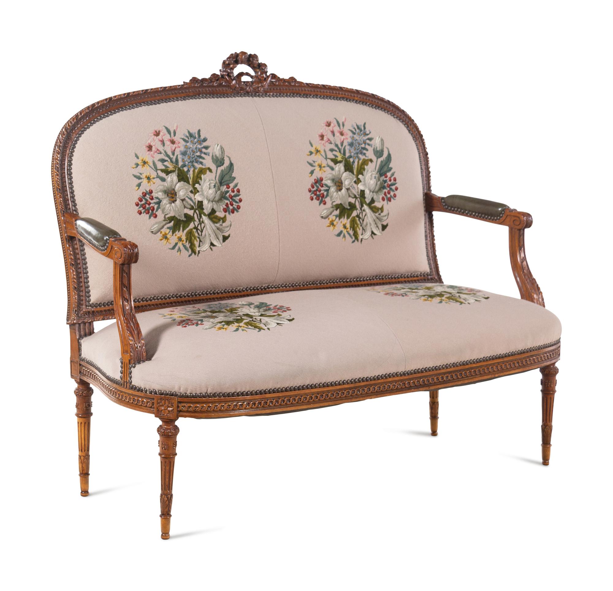 A Louis XVI Carved Walnut Seating Suite with Petit Point Upholstery