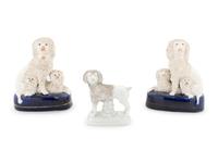 A Collection of Nine Staffordshire Glazed Poodles