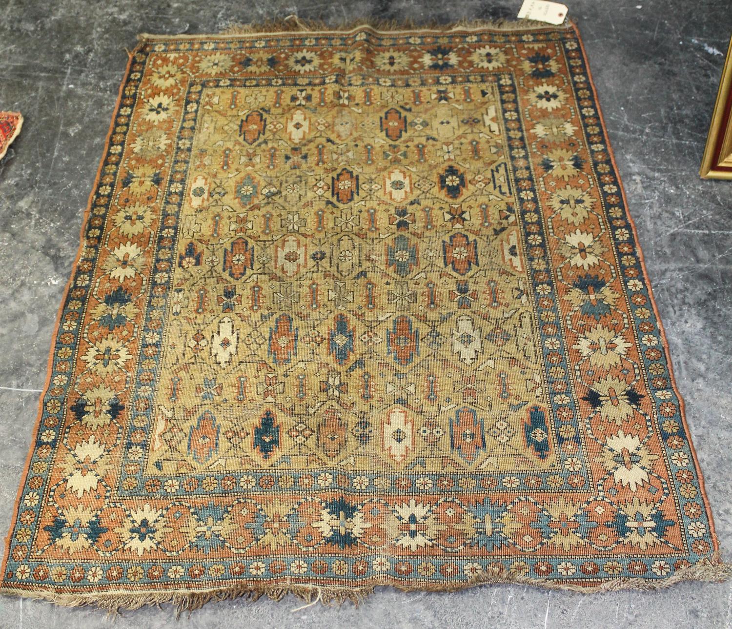 A Caucasian Wool Rug 4 feet 11 inches x 3 feet 10 inches. — EARLY 20TH CENTURY