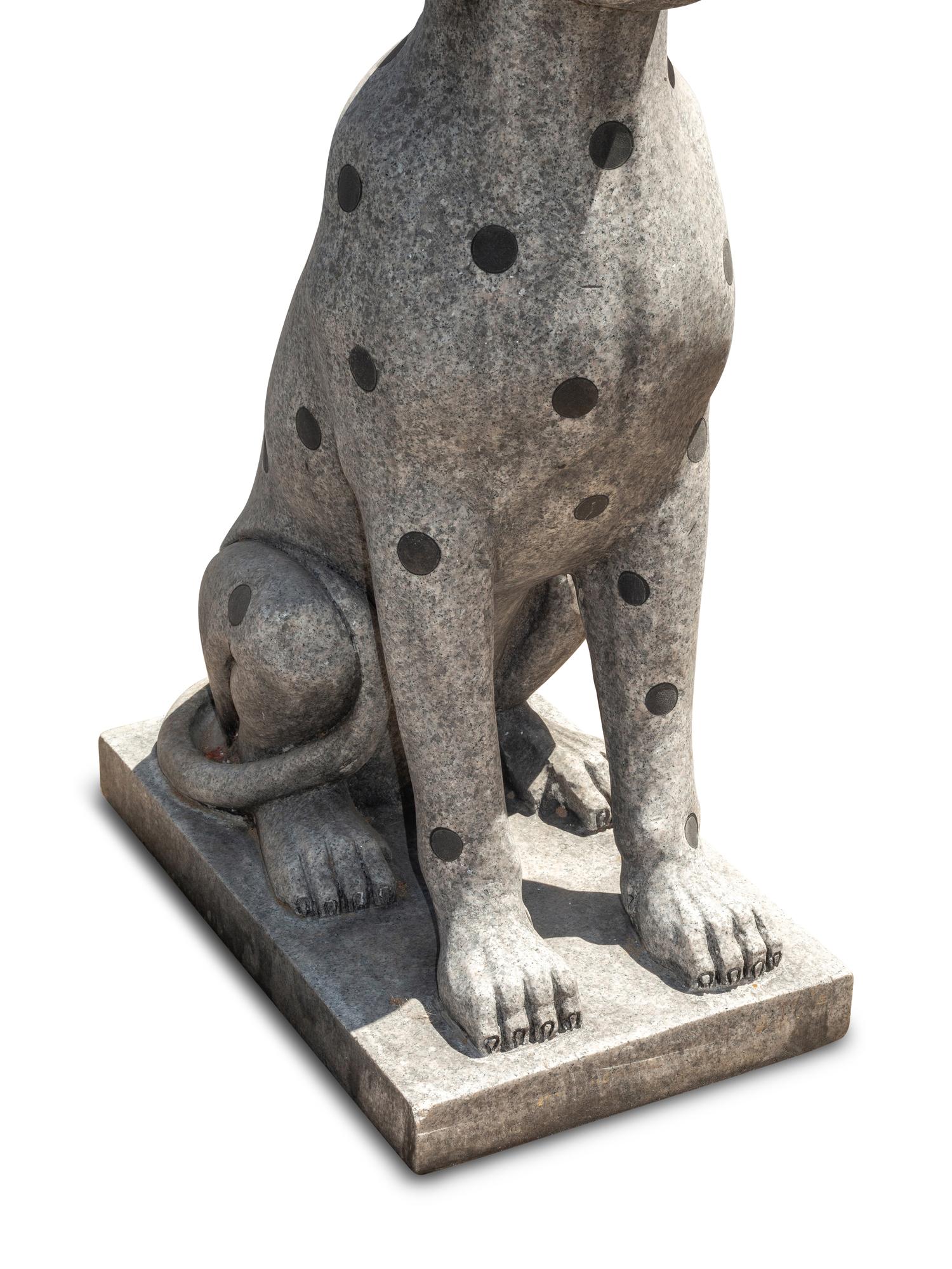 A Pair of Carved Granite and Black Marble Inlaid Seated Dogs
