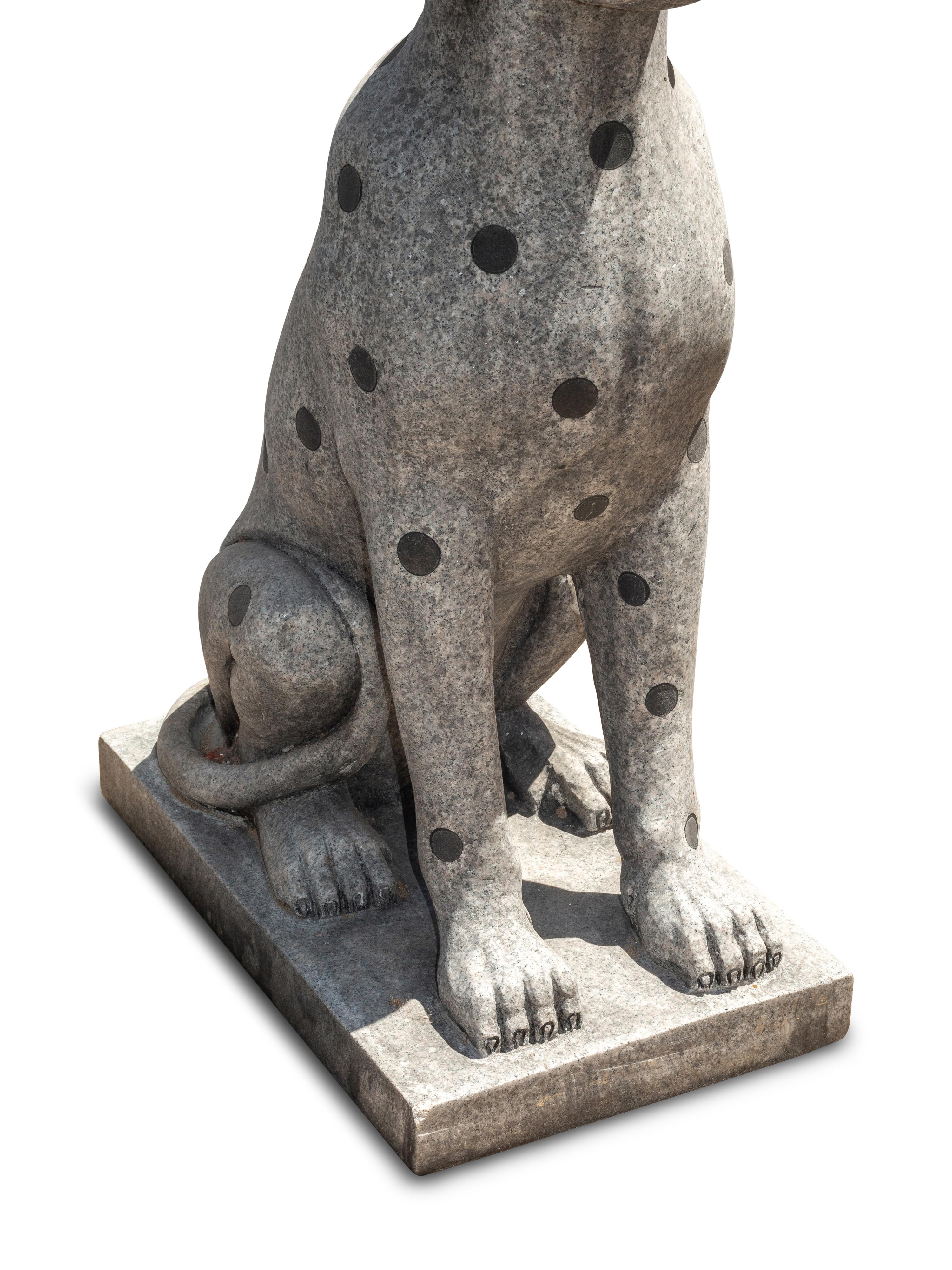 A Pair of Carved Granite and Black Marble Inlaid Seated Dogs