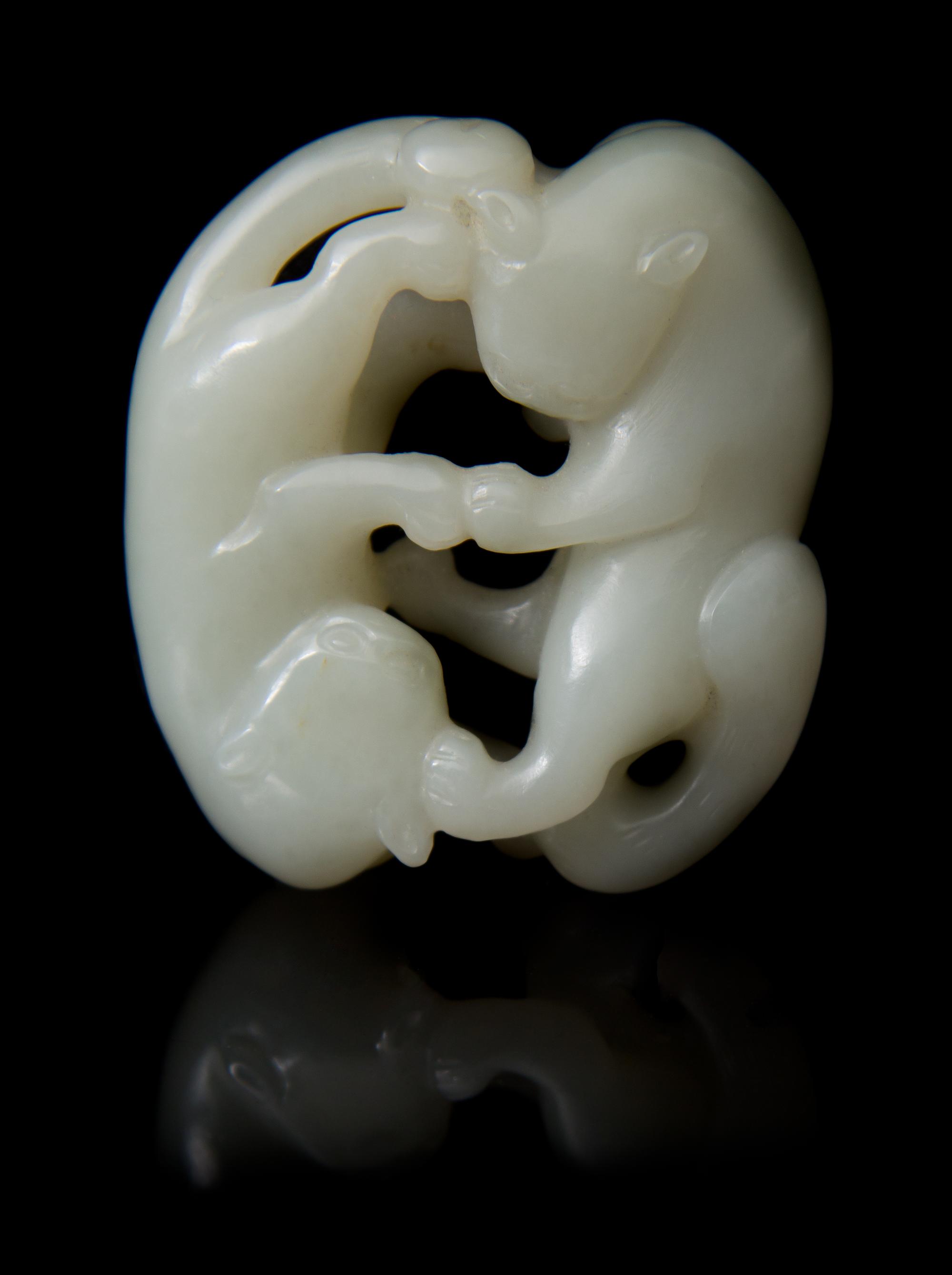 A Carved Jade Toggle Length 2 inches.