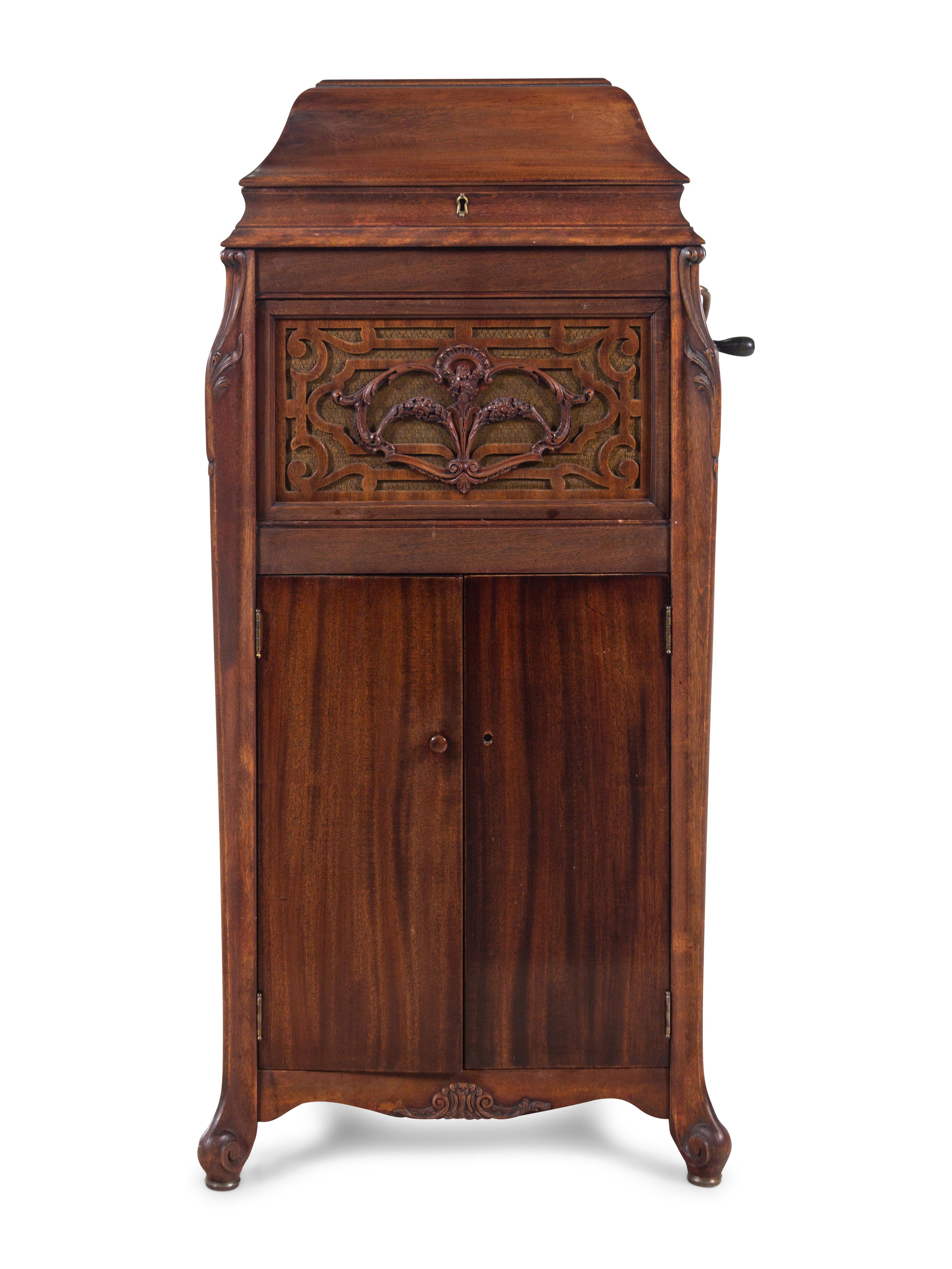 A Silvertone Carved and Stained Wood Tall Case Phonograph
