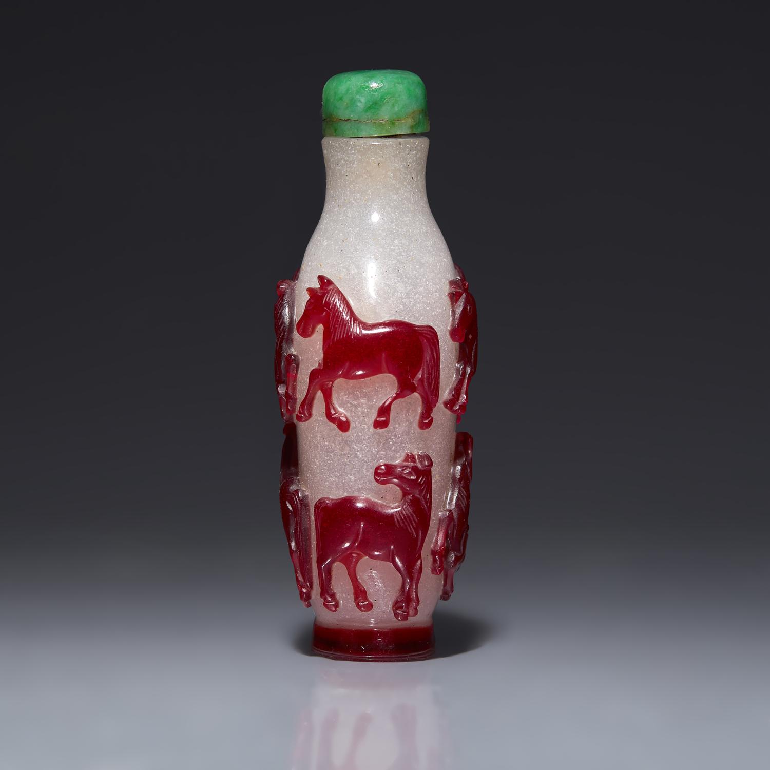 A Chinese Ruby Overlay 'Eight Horses of Wang Mu' Snuff Bottle, 19th Century 清中期 雪霏地套寶石紅料穆王八駿鼻烟壺