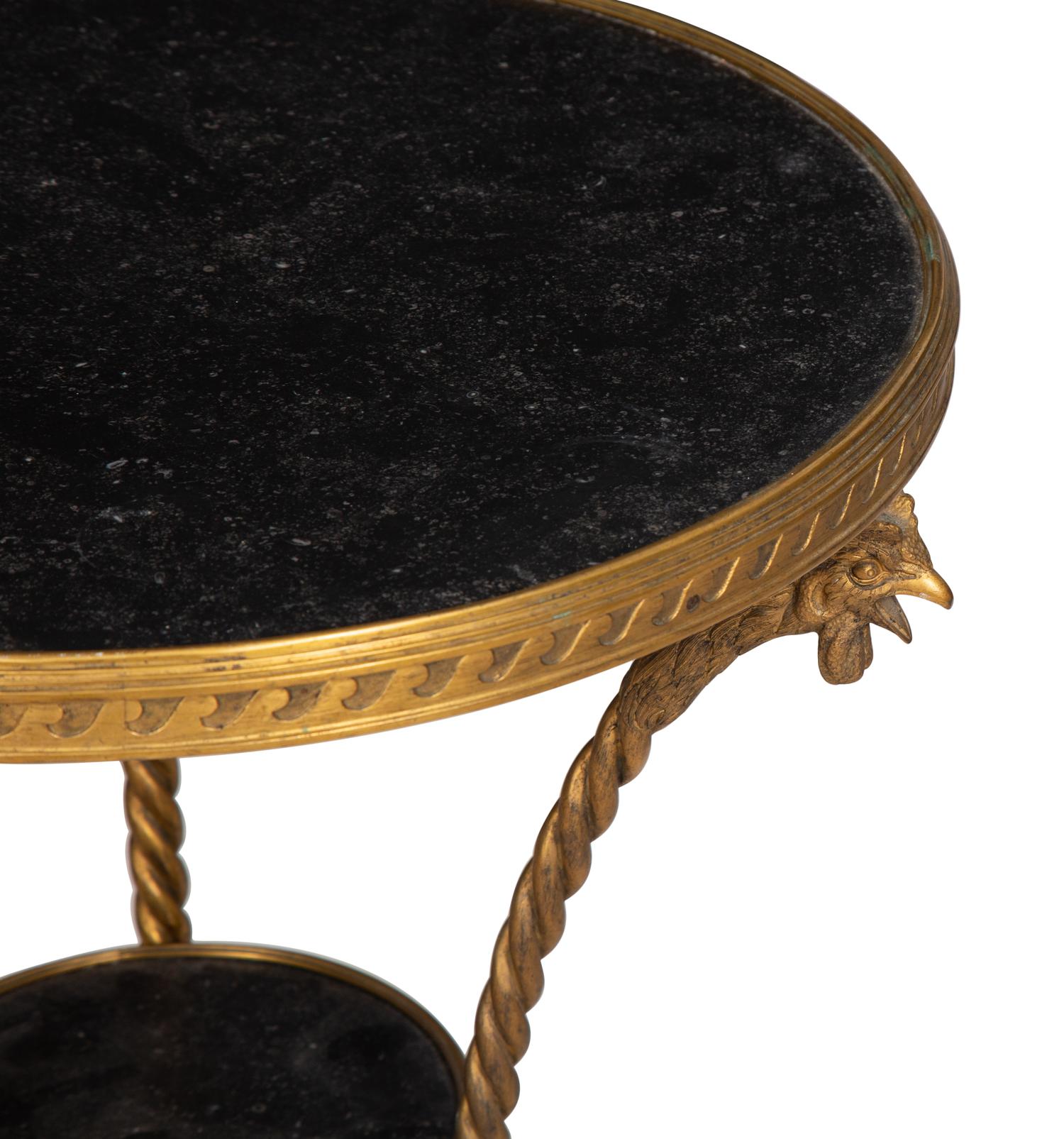 A Pair of French Neoclassical Gilt Bronze Gueridons with Inset Black Marble Tops