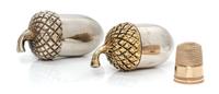 An American 14-Karat Gold Thimble and Acorn-Form Case, Tiffany & Co., New York, NY, the thimble having a dimpled top and body with a be