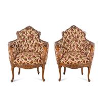 A Pair of Louis XV Style Fruitwood Bergères