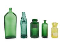 A Group of Green Glass Apothecary Bottles