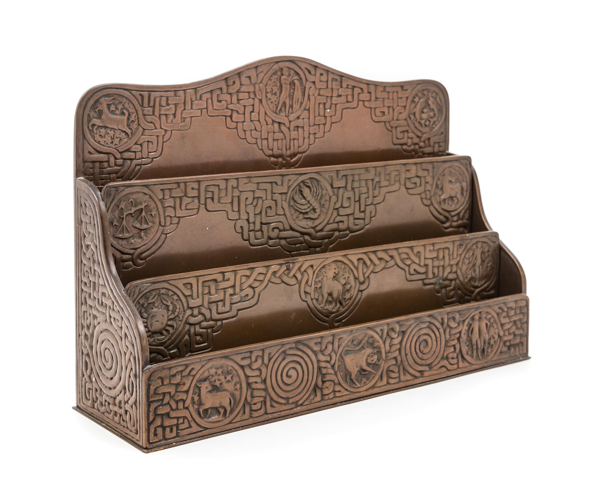Tiffany Studios, EARLY 20TH CENTURY, a Zodiac pattern letter rack (1030)