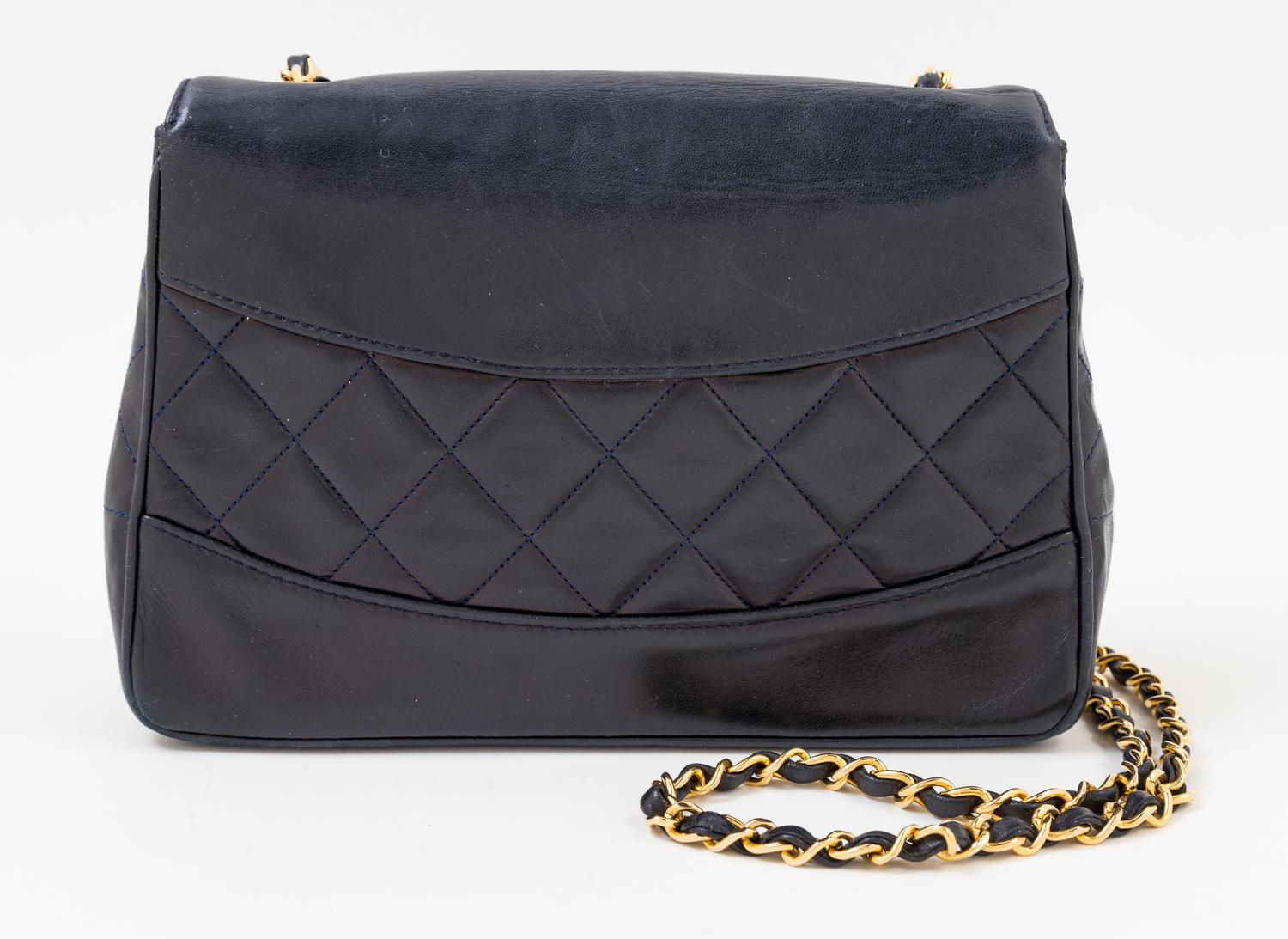 A Chanel Navy Lambskin Flap Shoulder Bag, 9.5" x 6.5" x 3"; Strap drop: 21".