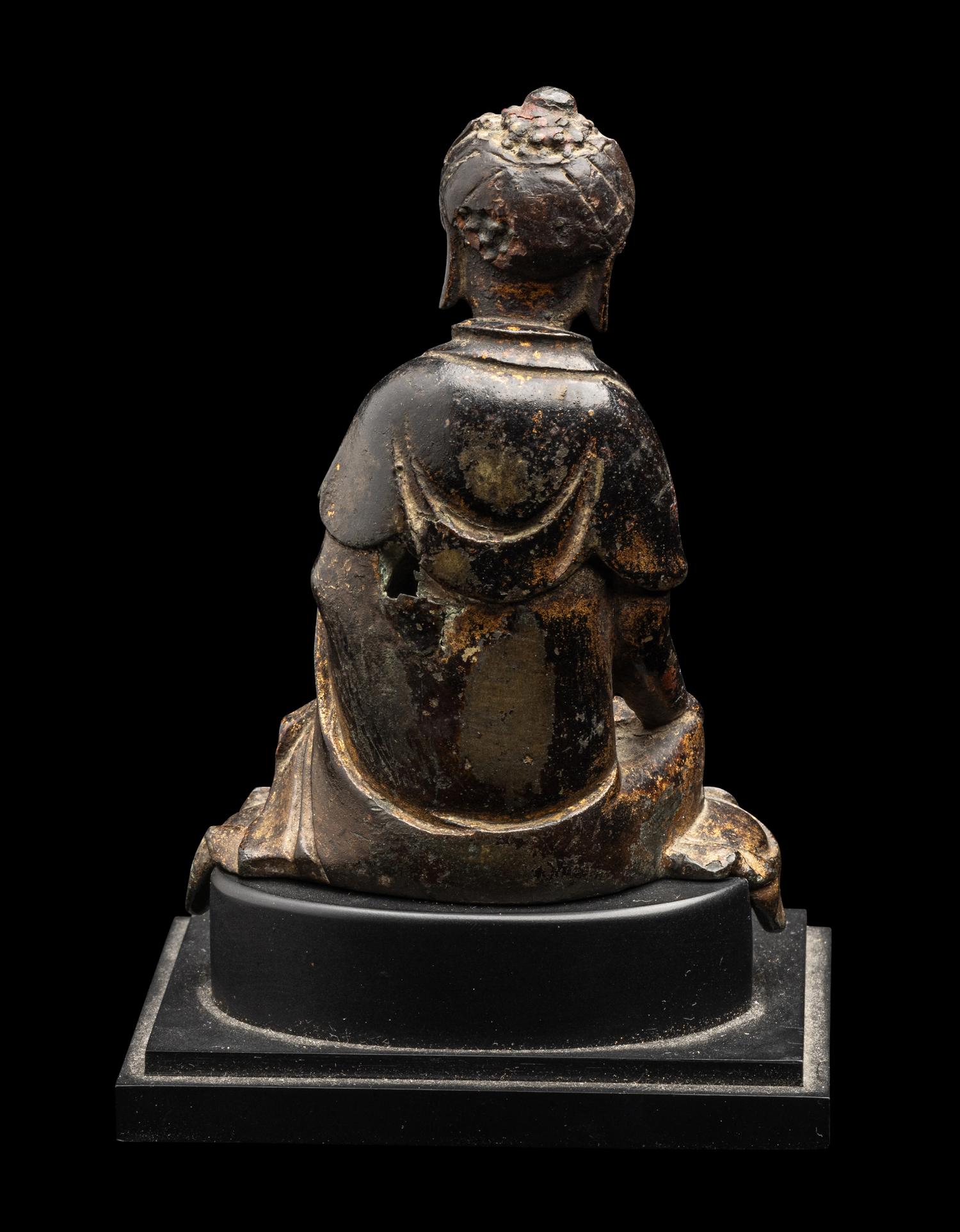 A Chinese Parcel-Gilt Bronze Figure of Buddha Shakyamuni, Ming Dynasty or Earlier 明或更早 銅局部鎏金坐佛