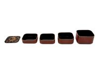 A Japanese Parcel Gilt and Lacquered Four-Tier Box