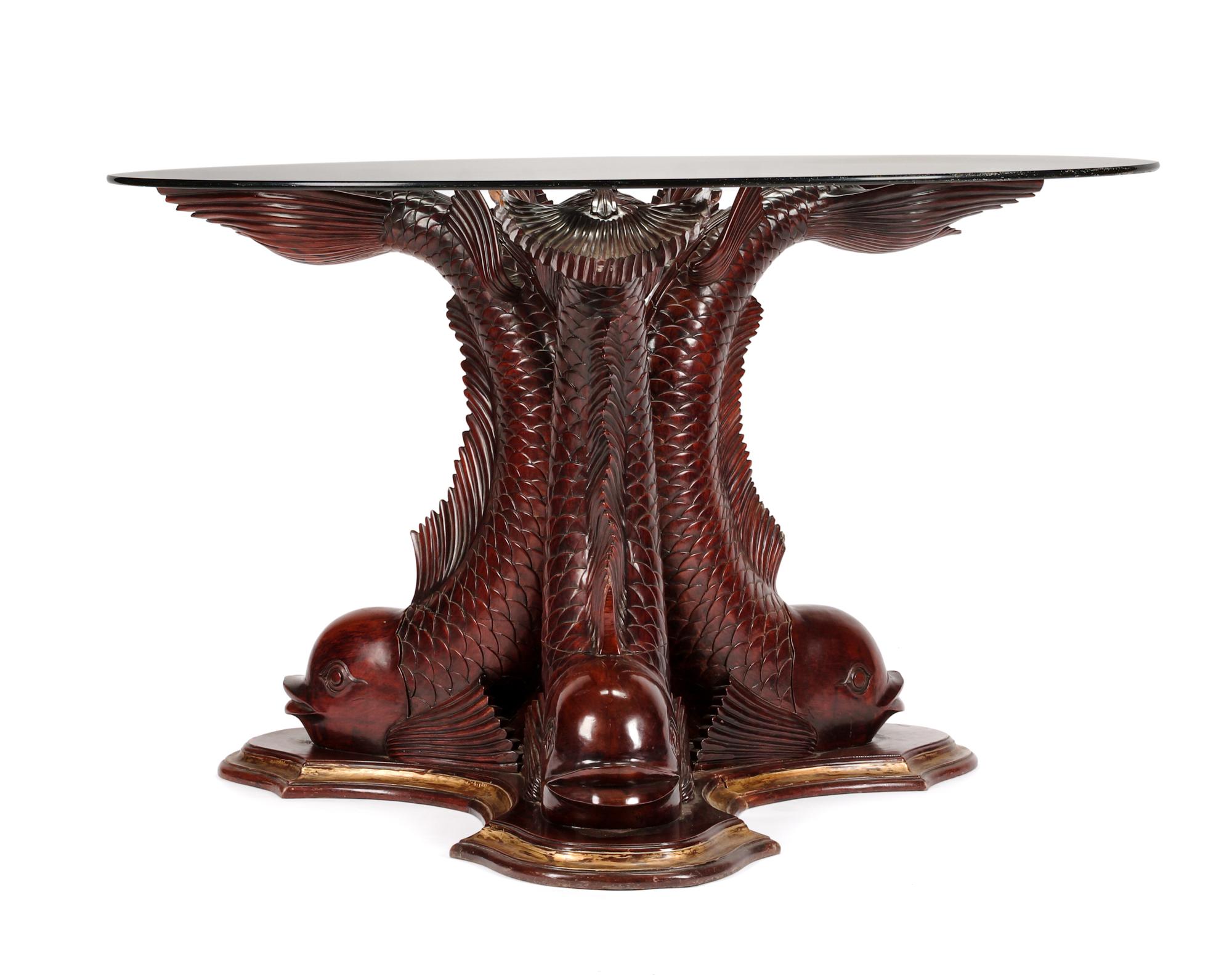 A Continental Carved and Parcel Gilt Center Table Height 29 1/4 x diameter of top 48 inches.