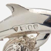 Garrard & Co. Ltd. (English, active 1722-Present) Set of Twelve Sterling Silver Dolphin-Form Place Card Holders, UK, 1995