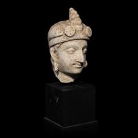 A Gandharan Stucco Head of Maitreya, Hadda Region, 4th/5th Century