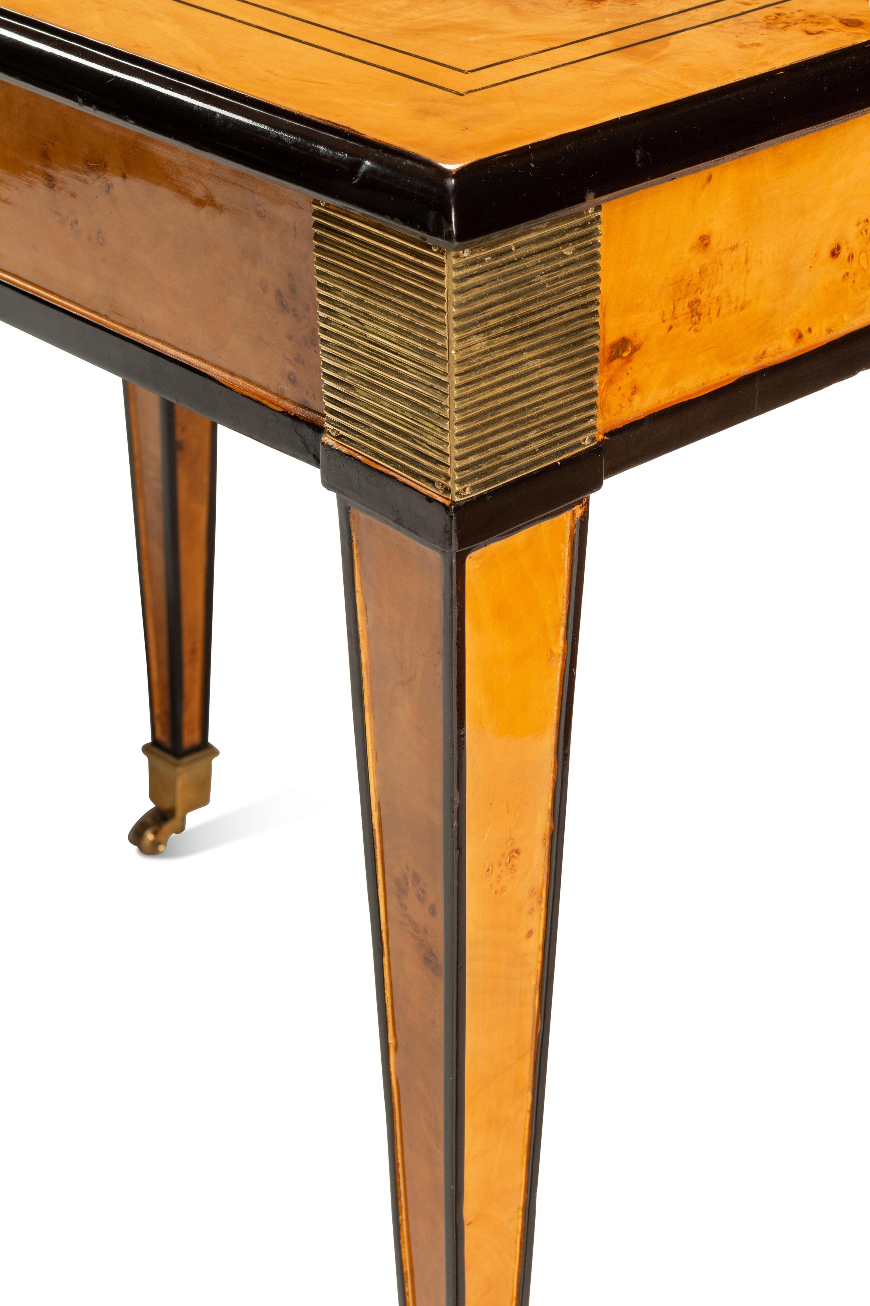 A Biedermeier Style Part-Ebonized Burlwood Dining Table