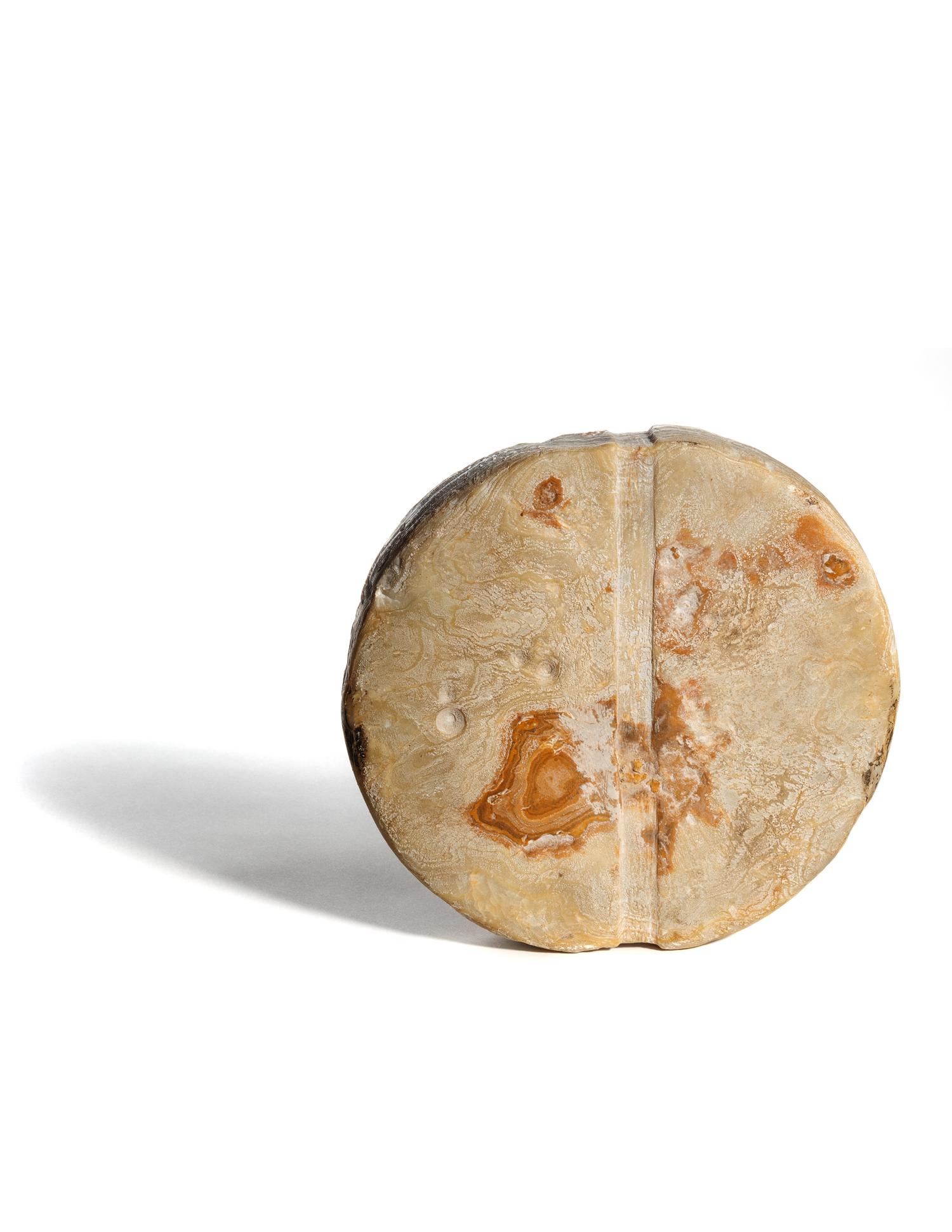 A Bactrian Mottled Green-Orange Stone Disk Ritual Object