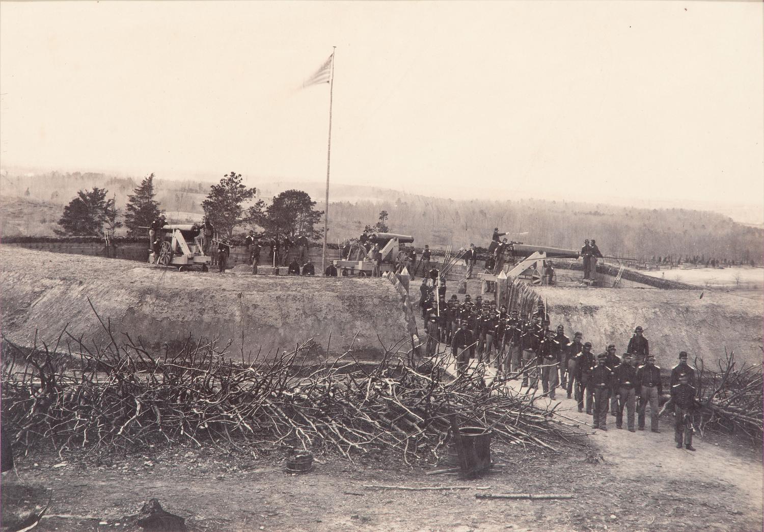 [CIVIL WAR]. [BRADY, Mathew (1822-1896), photographer, attrib.]. Large format photograph of Fort Stevens overlooking the Potomac River, including Union gunners in action. Ca 1864.