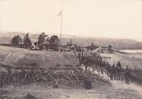 [CIVIL WAR]. [BRADY, Mathew (1822-1896), photographer, attrib.]. Large format photograph of Fort Stevens overlooking the Potomac River, including Union gunners in action. Ca 1864.