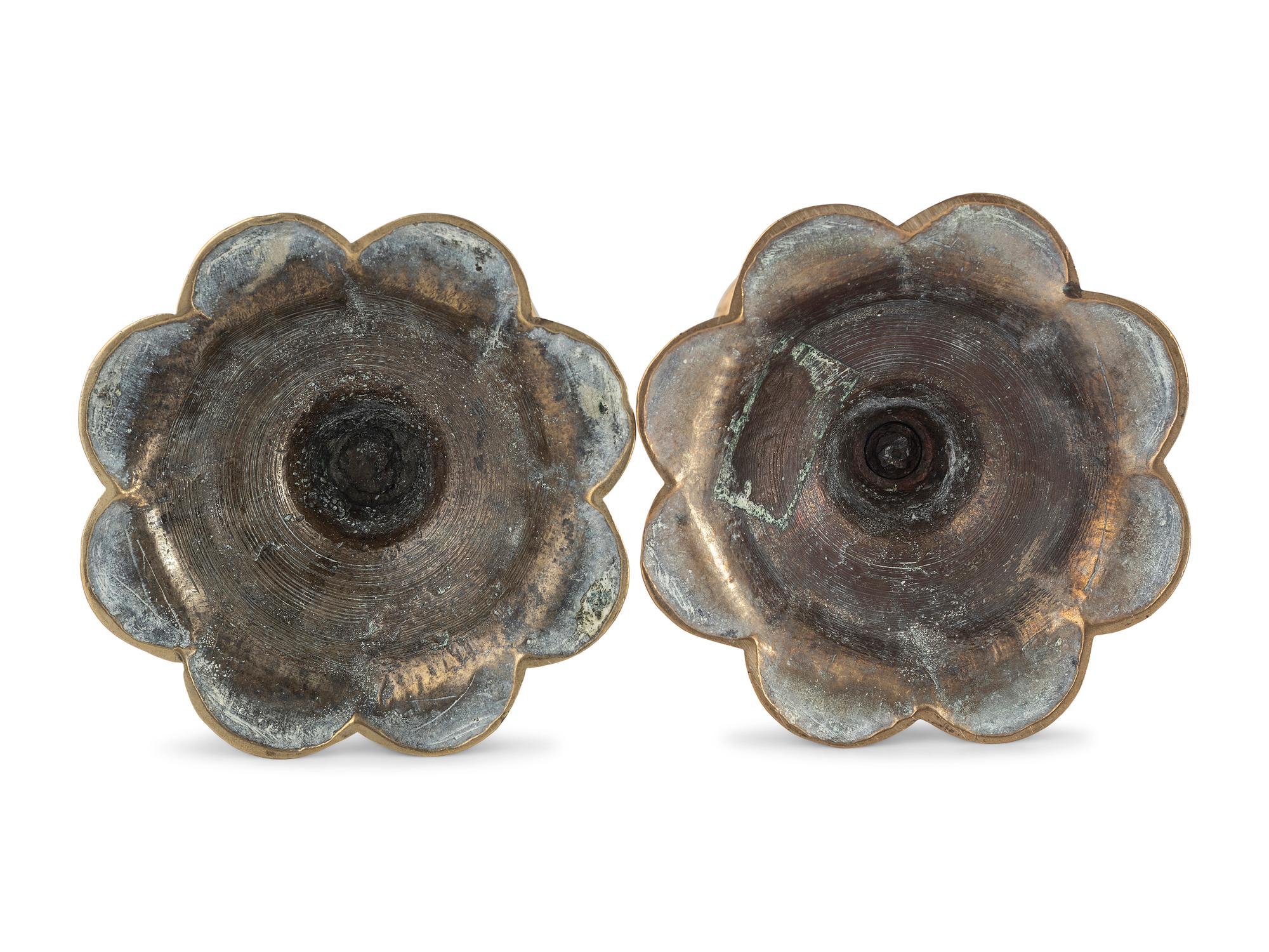 A Pair of English Brass Petal Base Candlesticks