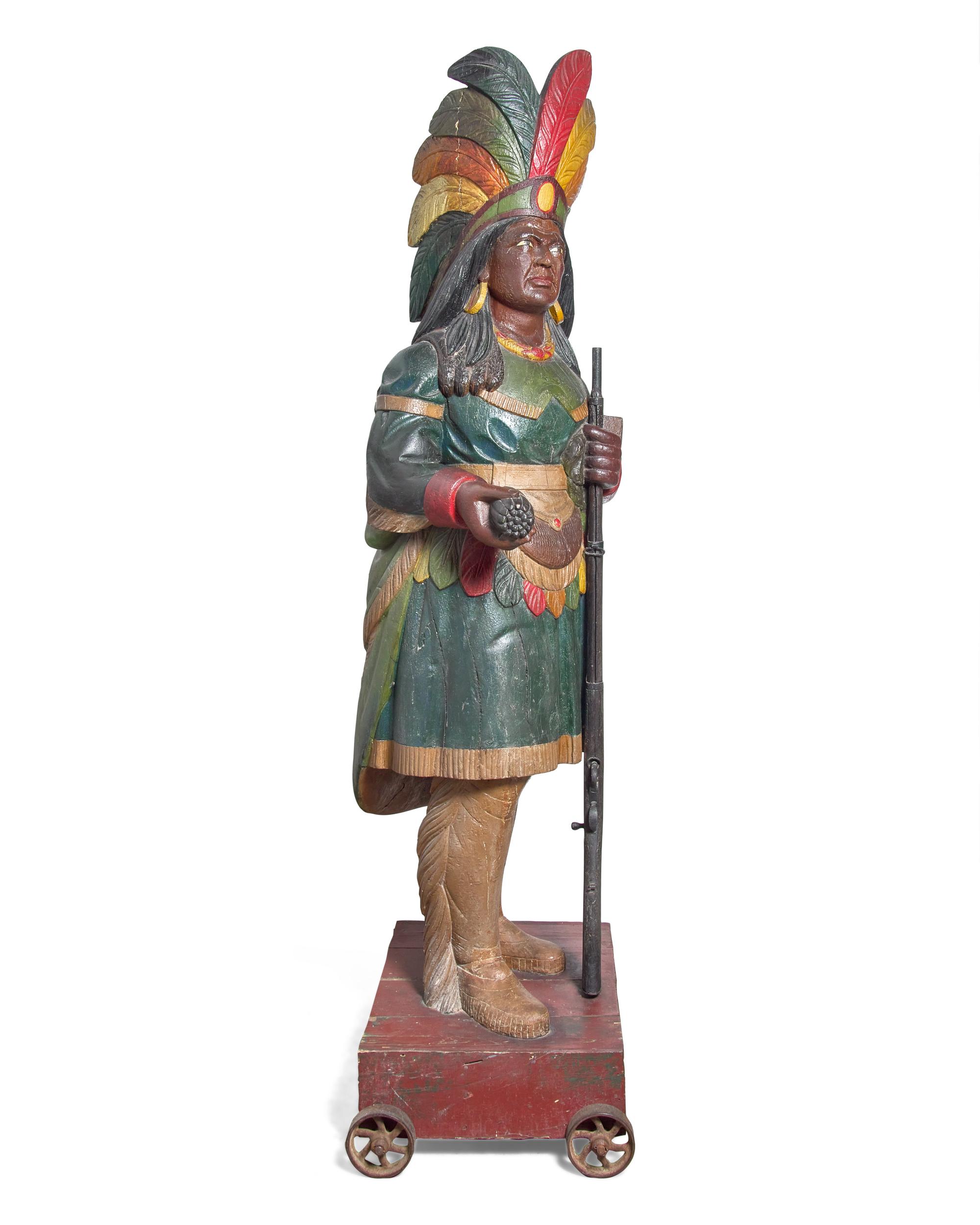 A Carved and Polychrome Painted Tobacconist Figure