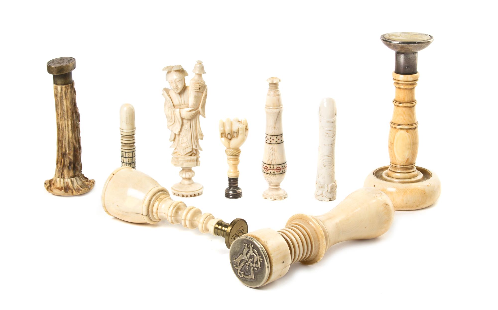 A Collection of Ivory, Antler and Bone Mounted Seals, Height of tallest 4 1/2 inches.