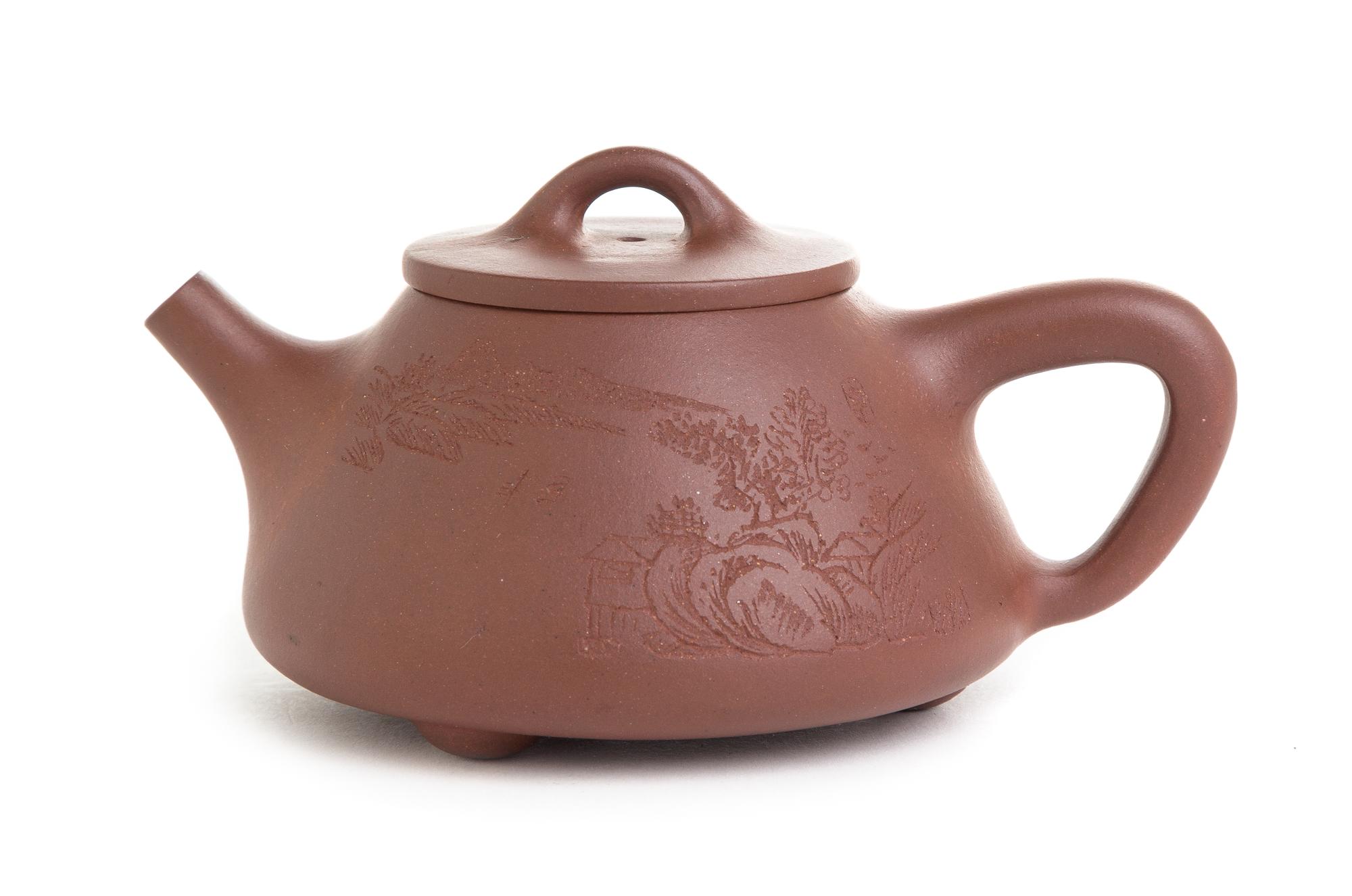 A Yixing Pottery Teapot Height 2 7/8 inches.