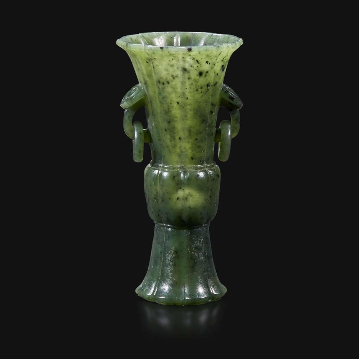 A small Chinese carved spinach green jade lobed gu-form vase