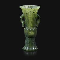 A small Chinese carved spinach green jade lobed gu-form vase